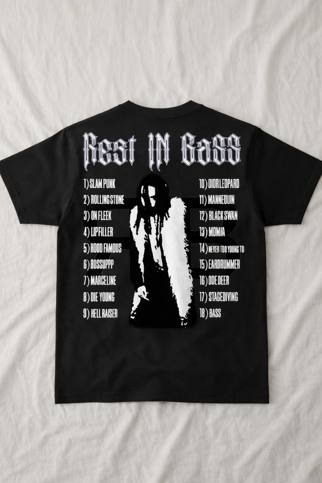 Black Che Rest In Bass graphic tee laid flat showing underground streetwear design